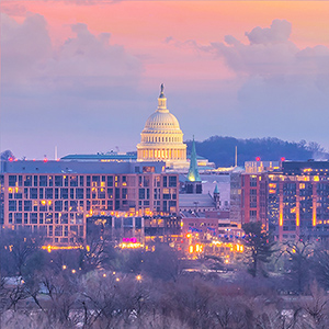 Photo of the U.S. Capitol building and surrounding area at sunrise 