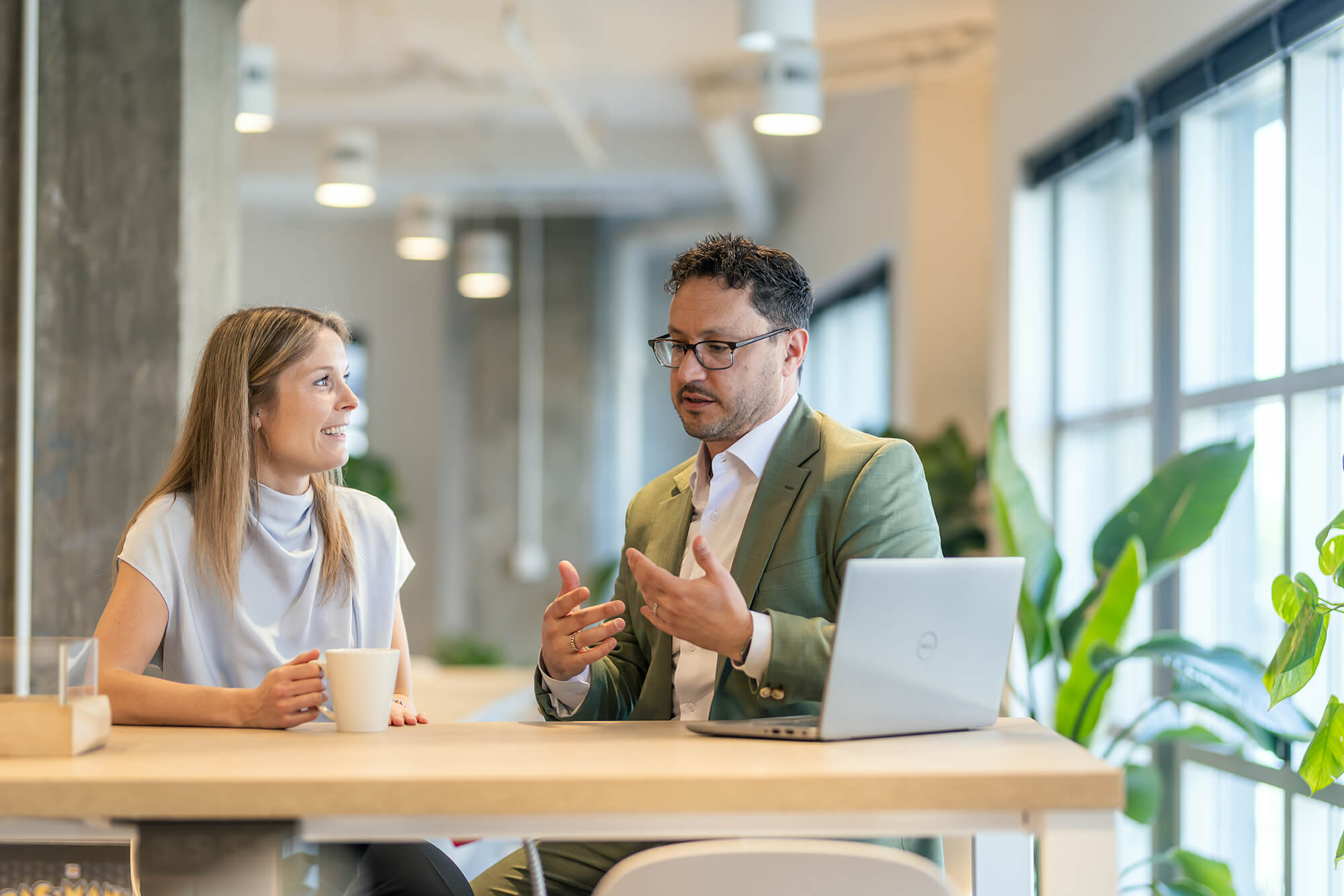 Two people having a discussion in the office.