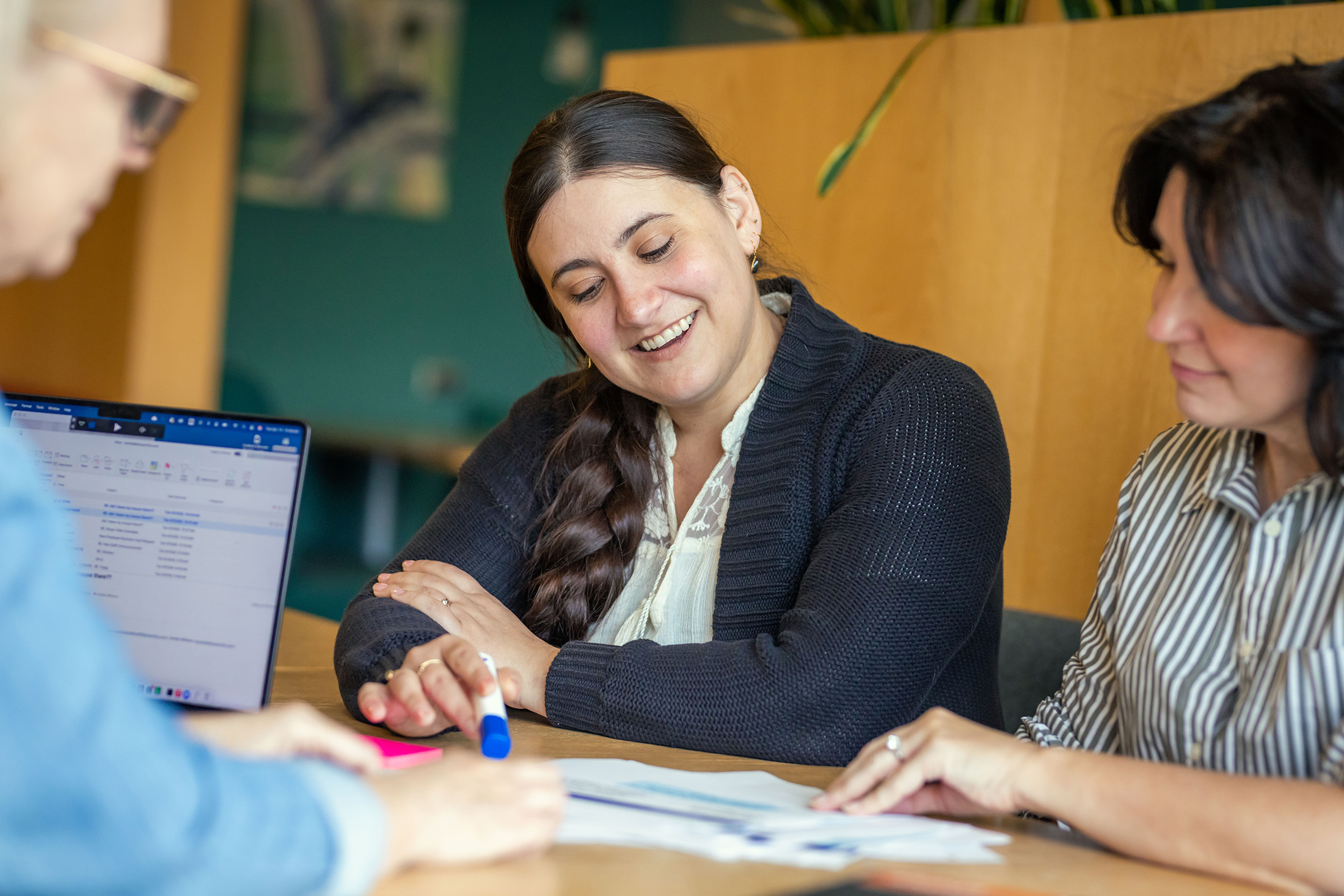 Akoya employees reviewing documents